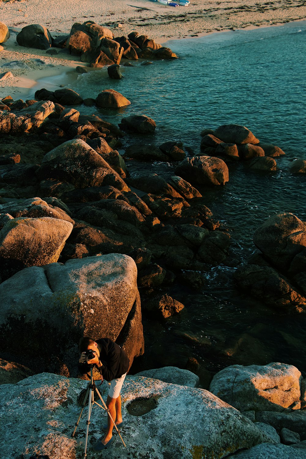 man standing on rock