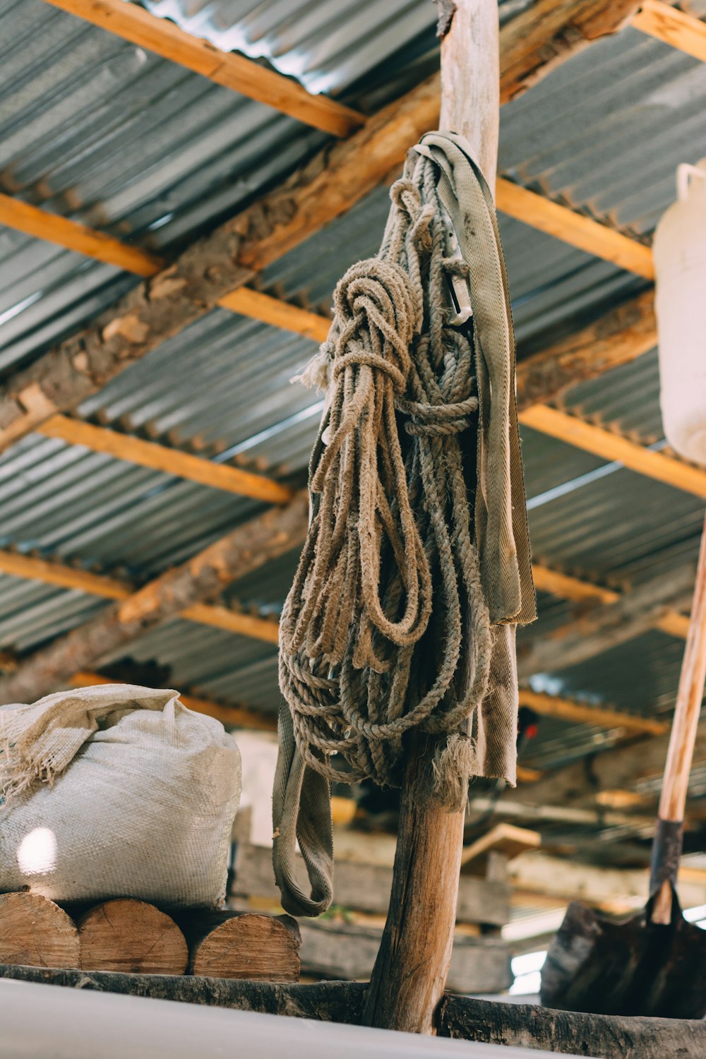 two hanged ropes in beige wooden pole