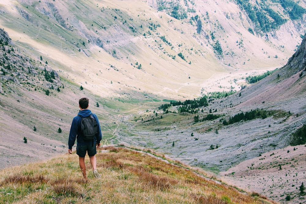 man on top of mountain