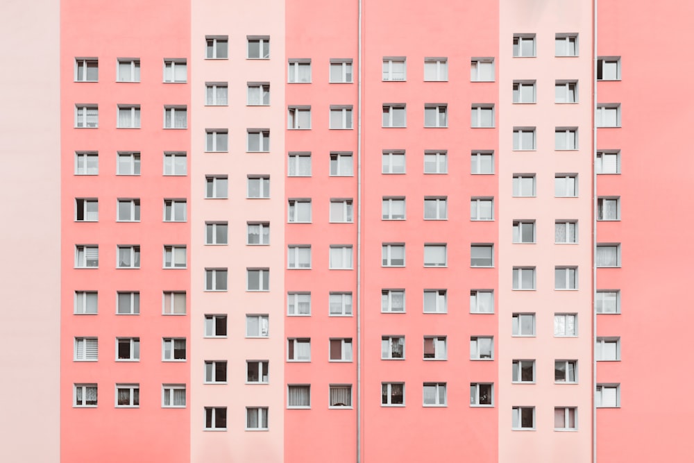 minimalist photography of pink high-rise building