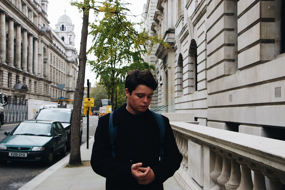 shallow focus photo of man in black jacket