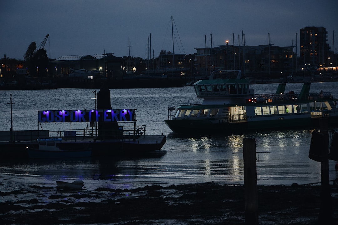 ferry approaching dock at nighttime