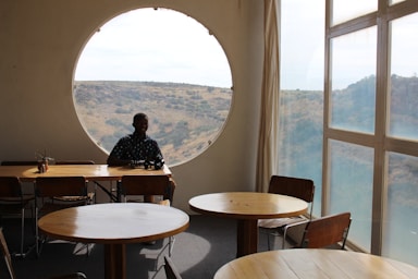 shapes for photo composition,how to photograph man sitting on chair near window