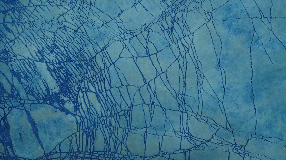 a painting of blue paint on a blue background