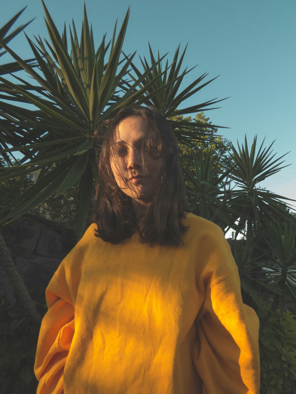 woman in yellow long-sleeved shirt