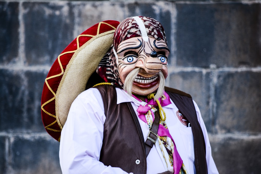 person wearing caricature mask and sombrero