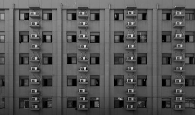 grayscale photography of high-rise building