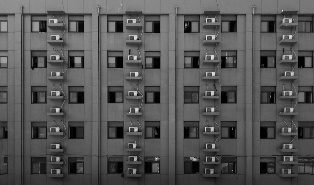 grayscale photography of high-rise building