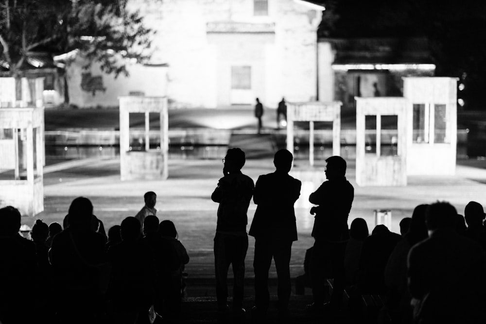 silhouette photography of people near building