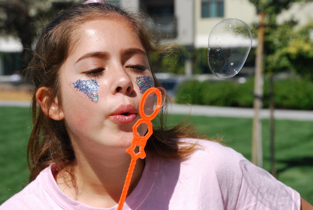 person blowing bubble