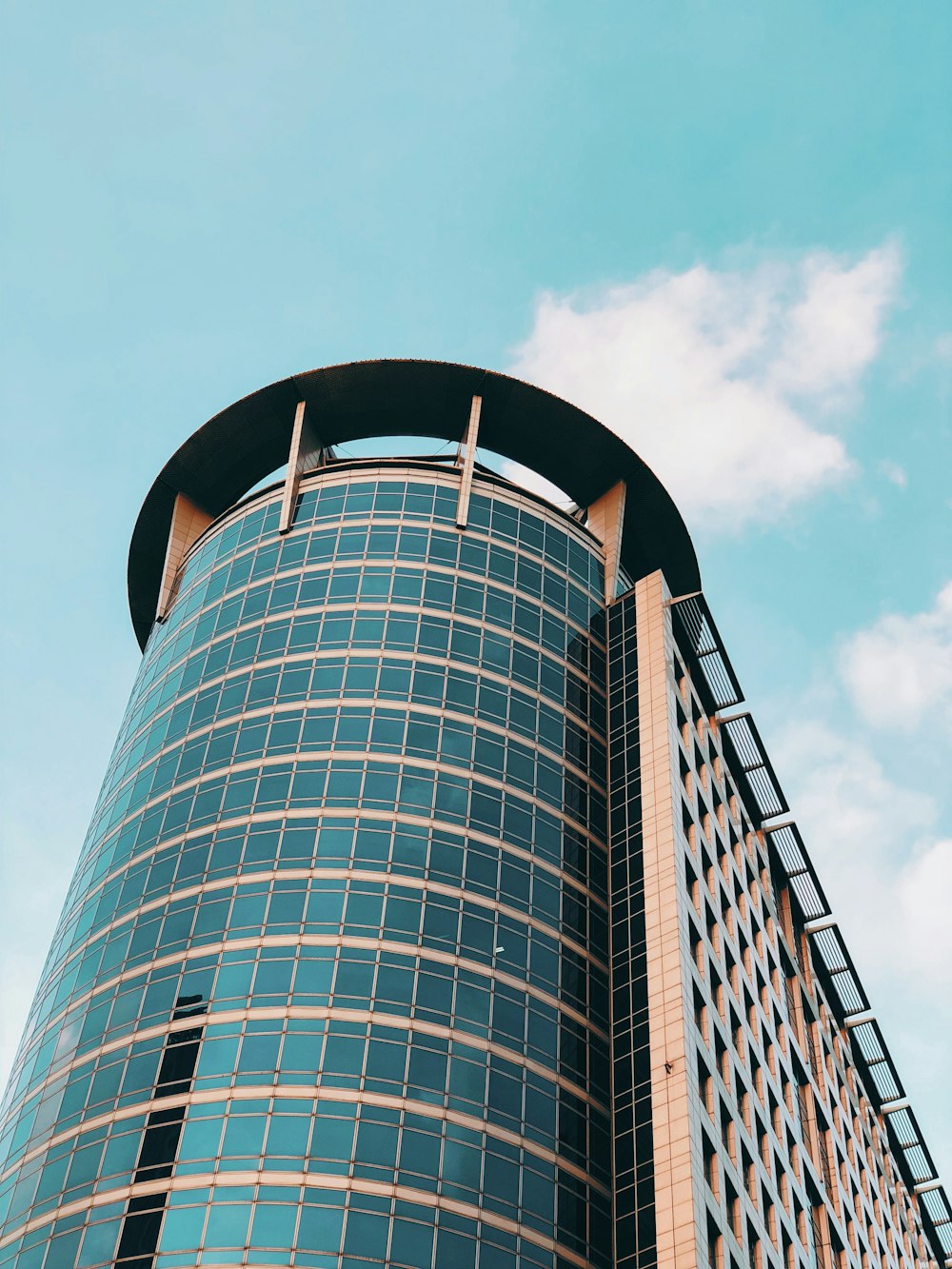 low angle view of cylinder glass building