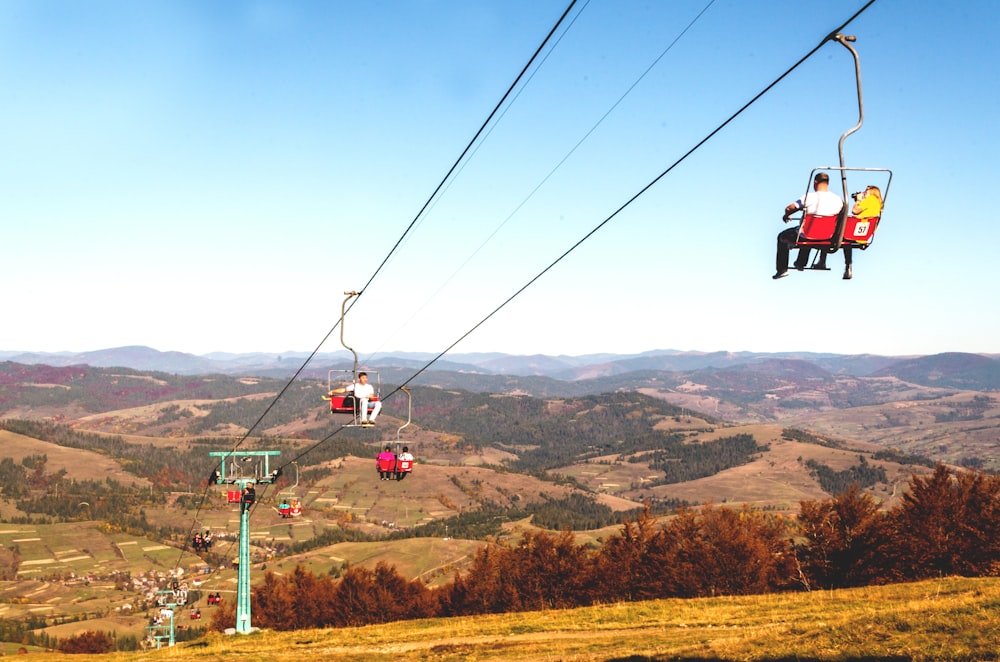 people riding cable car