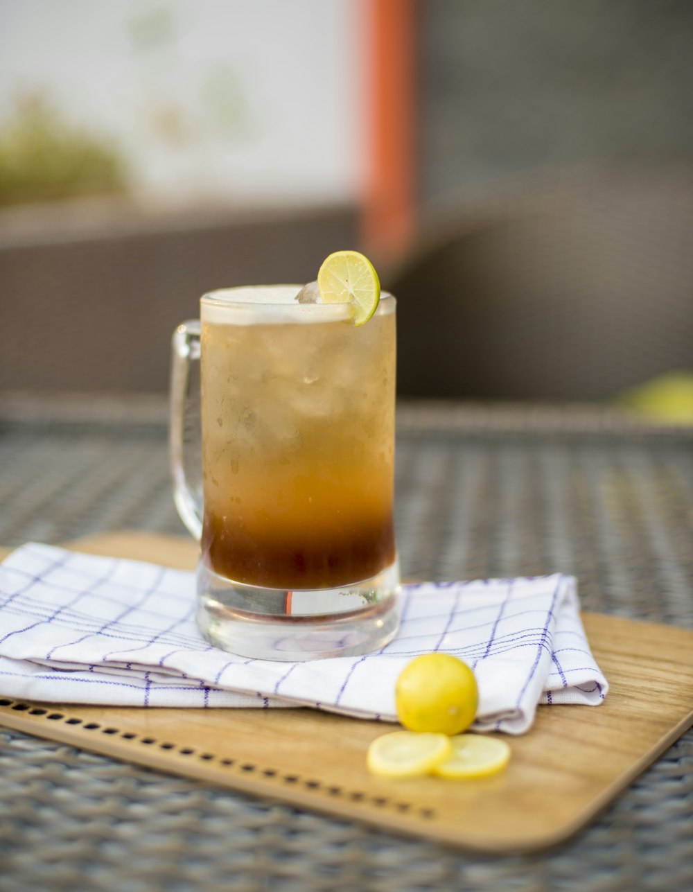 beverage filled glass mug on white textile