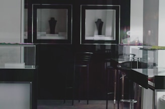 A luxurious menswear collection displayed in a minimalist gallery setting.