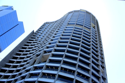 low angle photography of grey high rise building