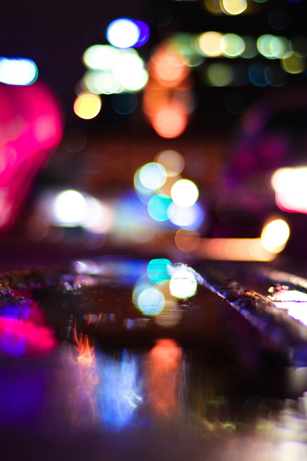 a blurry photo of a city street at night