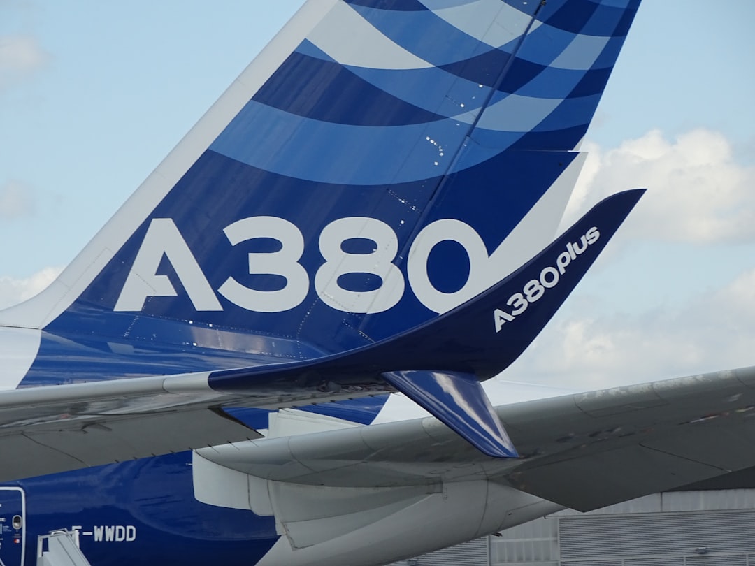 blue and white airplane,