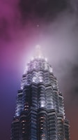low-angle photography of grey high rise building