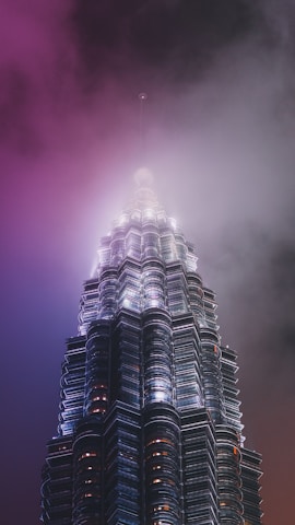 low-angle photography of grey high rise building