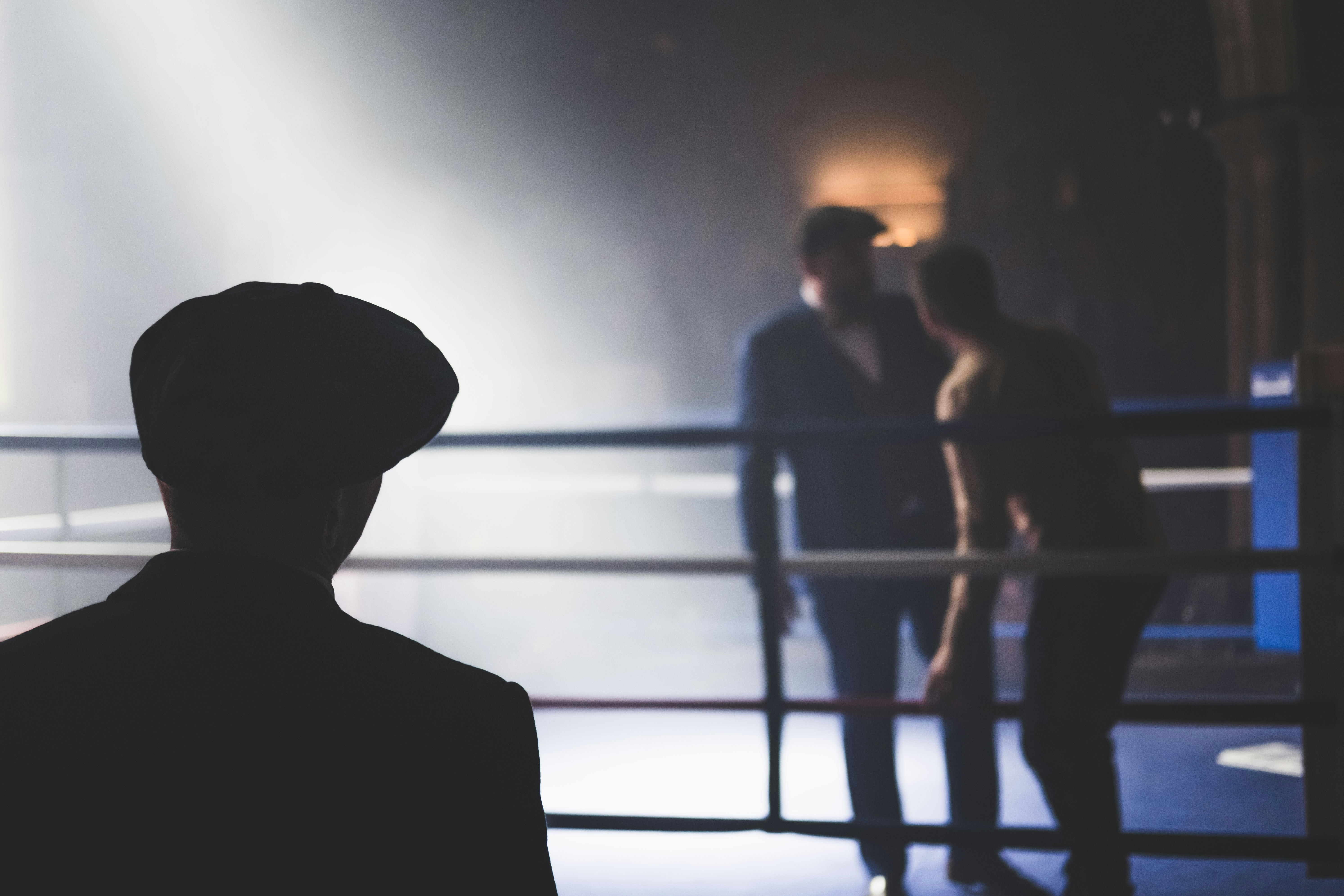 A bystander watches the officials check the ring