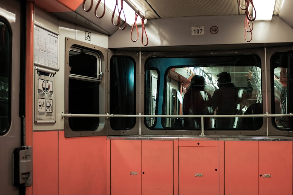 person standing inside train