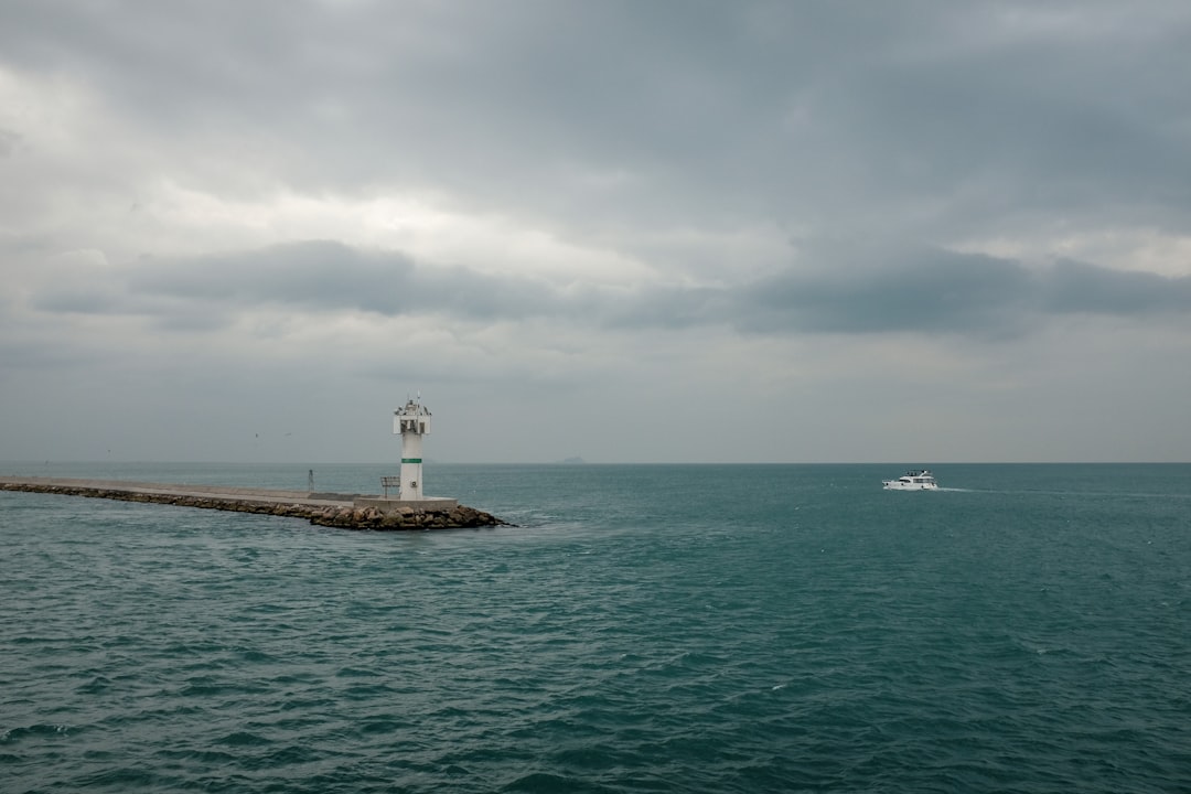 boat near lighthouse, Sea