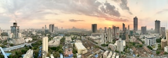 A panoramic view of a bustling city skyline under construction.