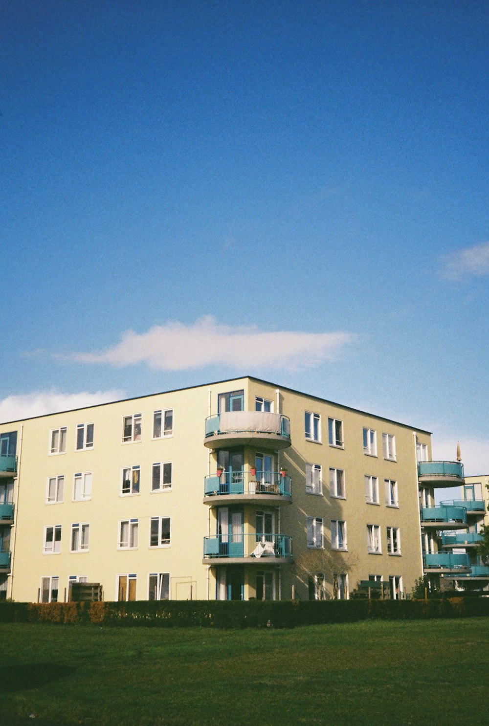 beige concrete building under blue sky during daytime