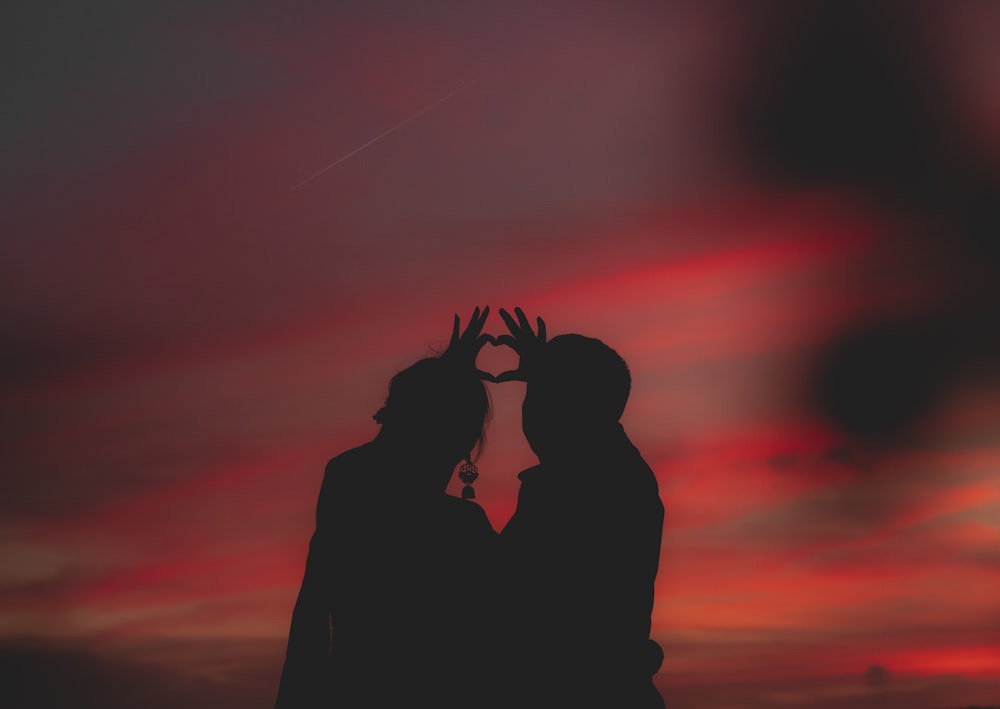 silhouette photography of two person