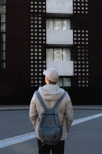 man standing in front of building