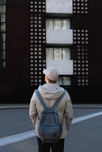 man standing in front of building