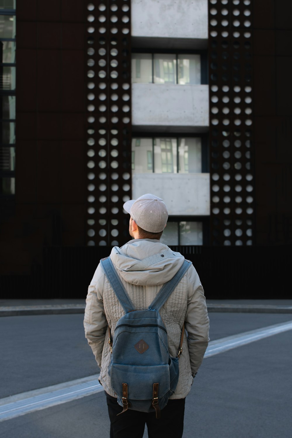 man standing in front of building