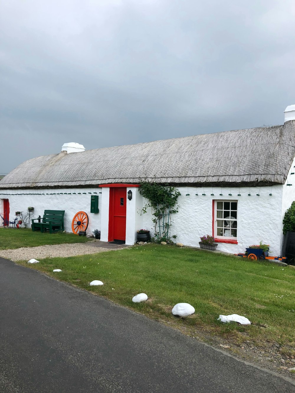 white and gray concrete house under cloudy sky