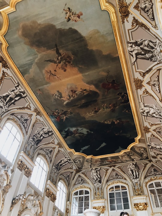 group of fighting people on islet painted ceiling in Winter Palace Russia
