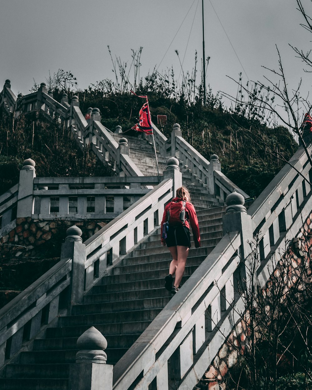 woman about to walk on gray and black staircase