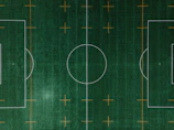 Overhead view of a soccer field with tactical lines and player movements illustrated.
