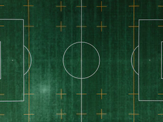 A soccer field with highlighted player positions and movement paths.