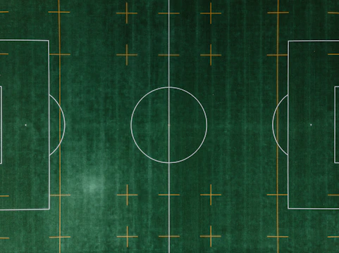 A soccer field with highlighted player positions and movement paths.