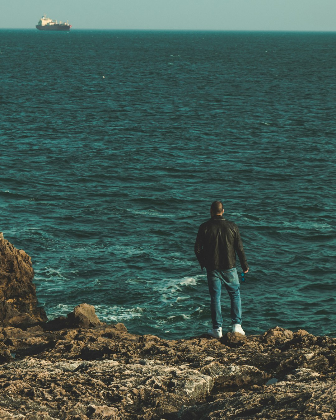 man standing near sea
