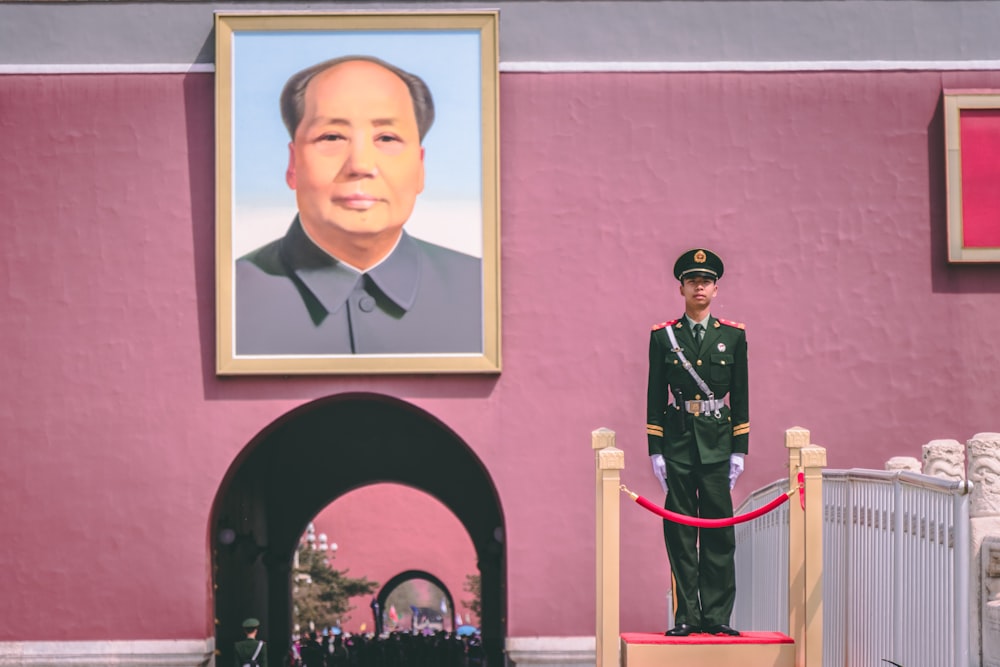 soldier standing near photo frame