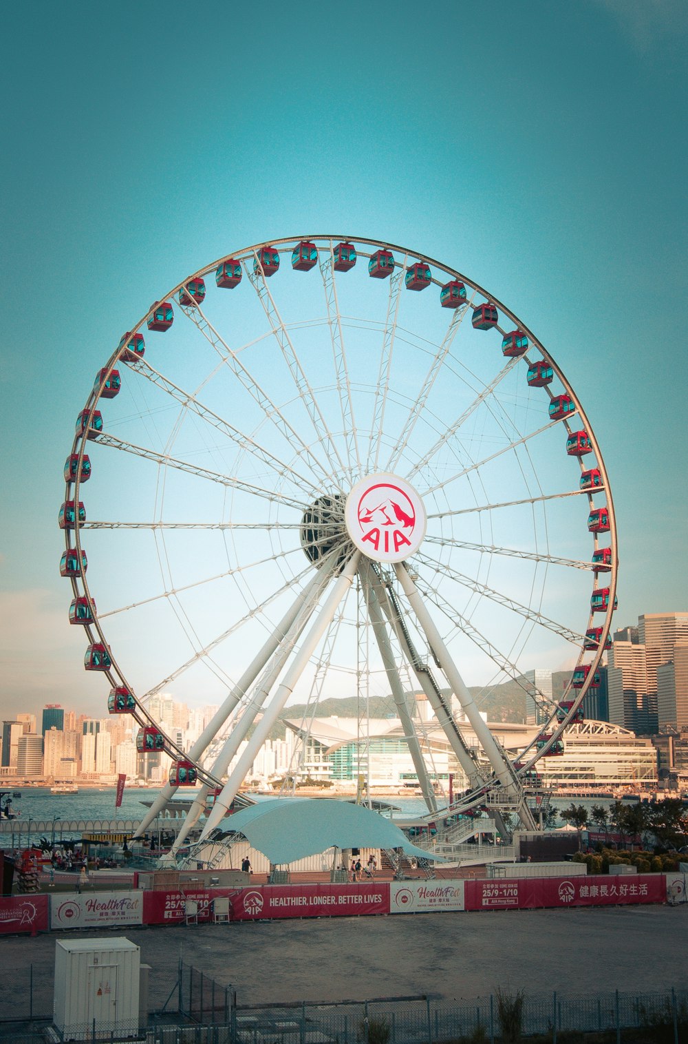 gray and red metal ferris wheel