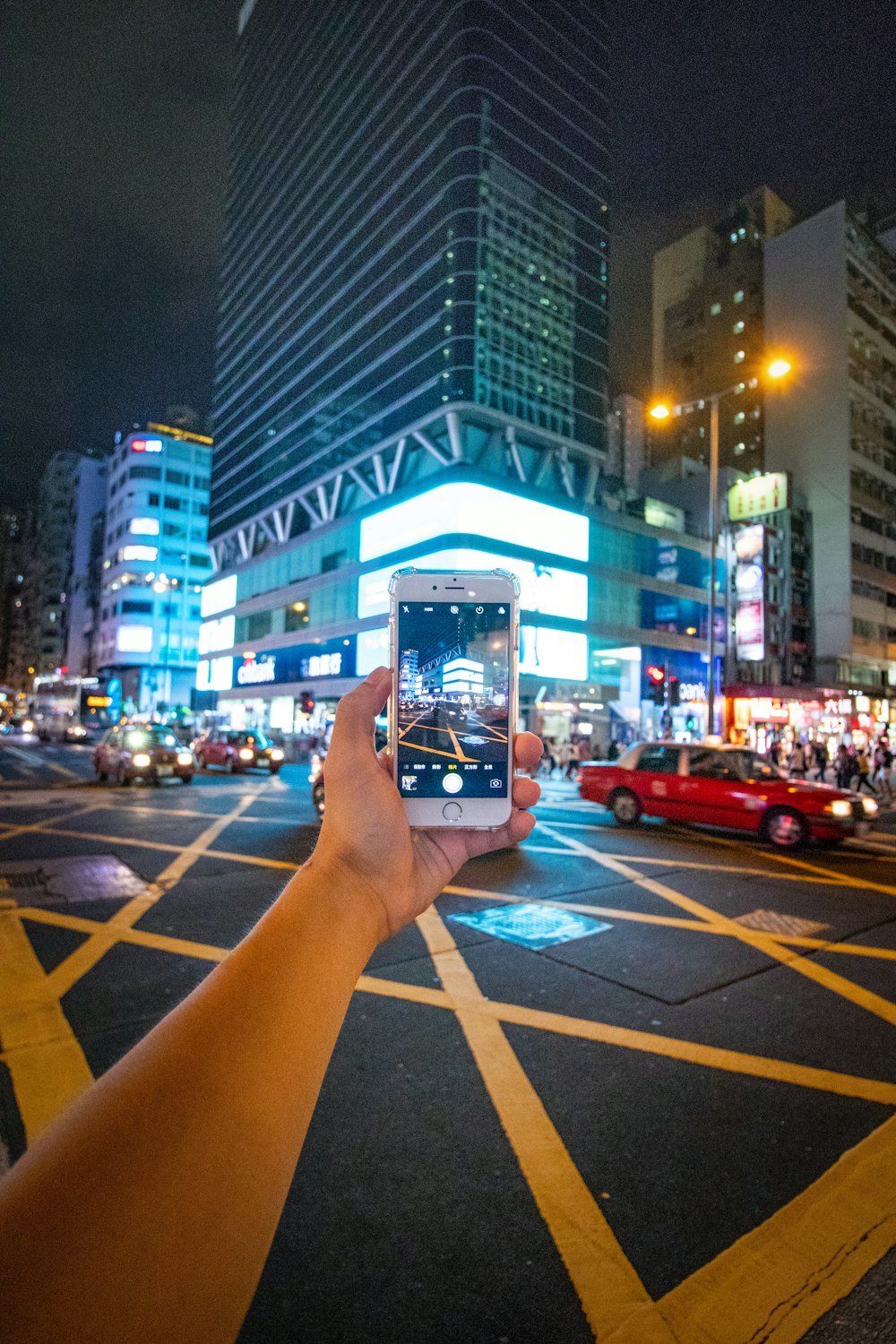 person taking picture using silver iPhone 6