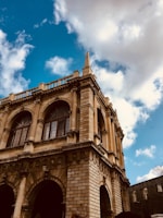 Ancient architectural details of a historic building under a clear blue sky.