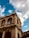 A historic building standing under a bright blue sky, symbolizing preservation and heritage.