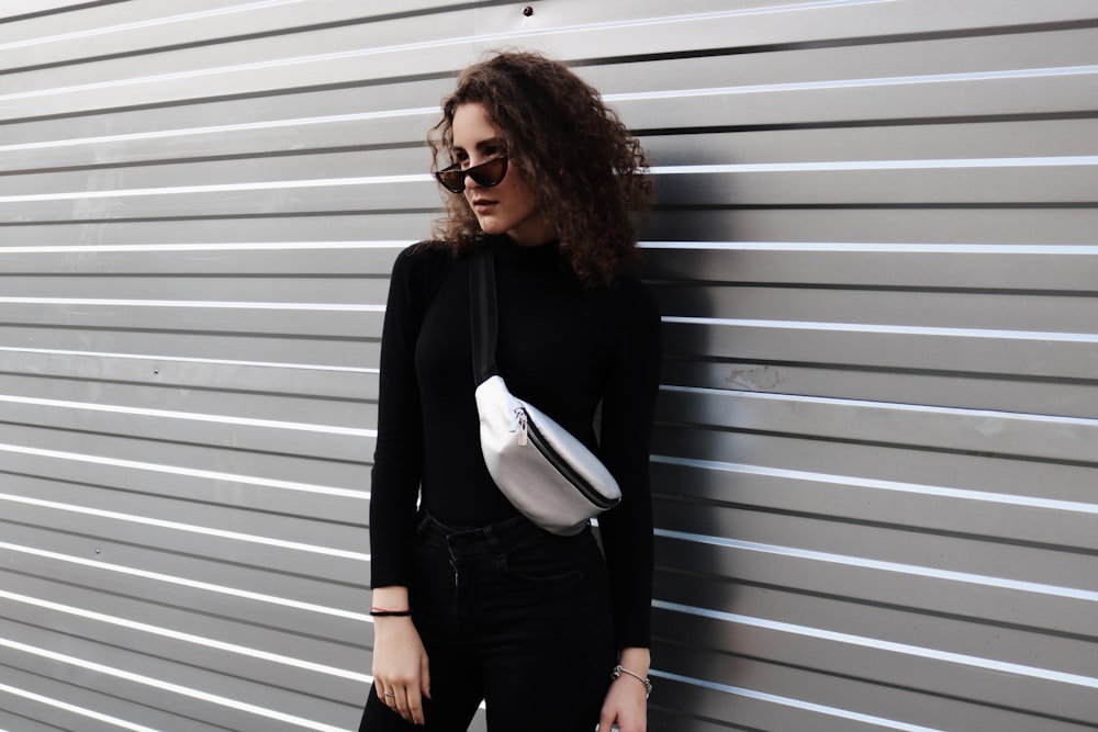 standing woman near wall