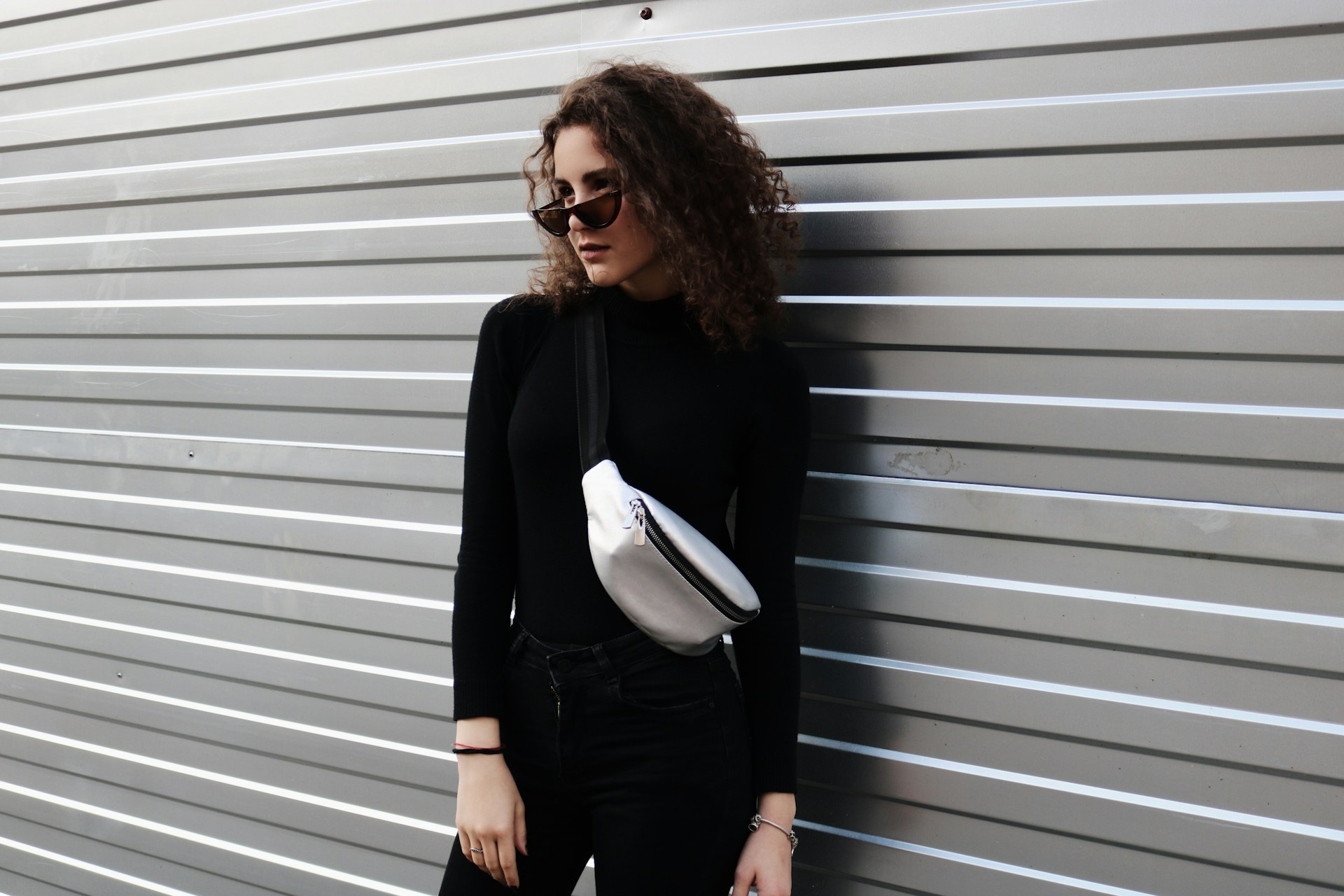 standing woman near wall