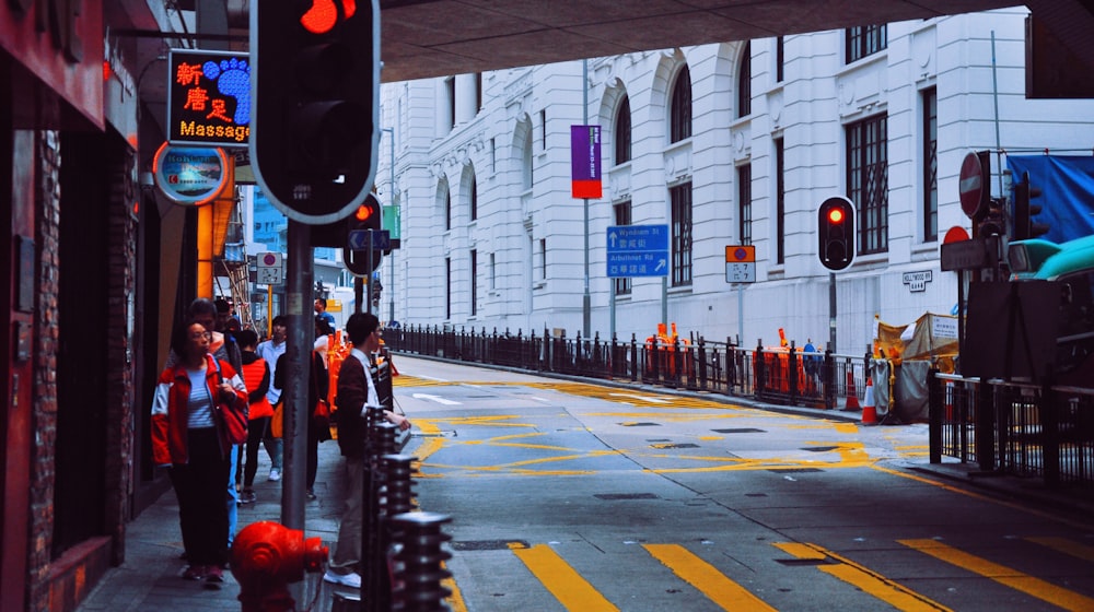 gray concrete road beside buildings during daytime