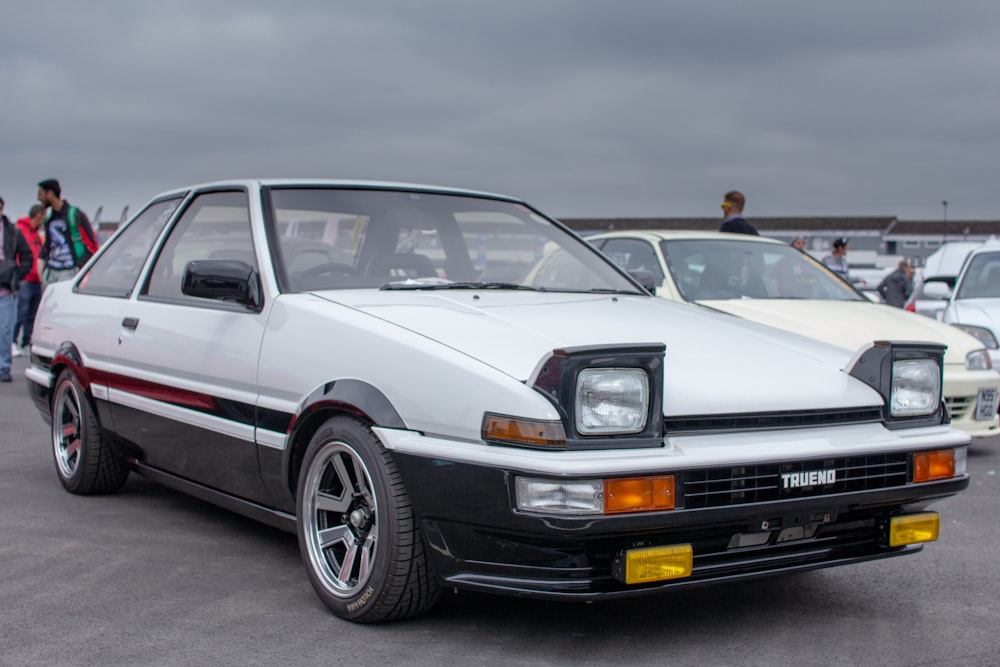 white coupe on road