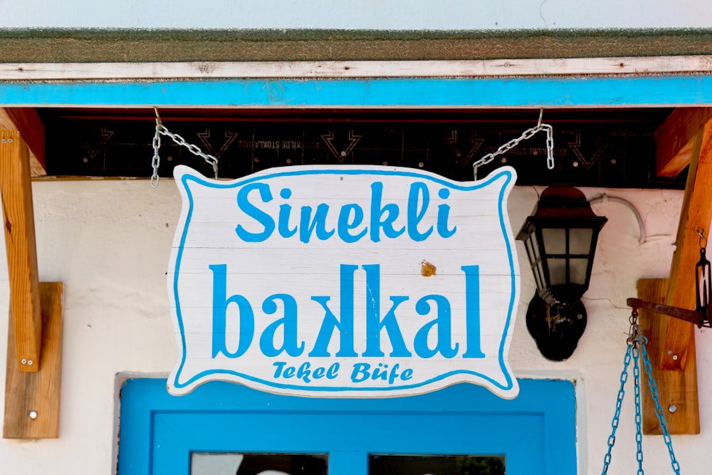 white and blue hanging signage