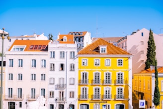 yellow and white multi-storey building facade